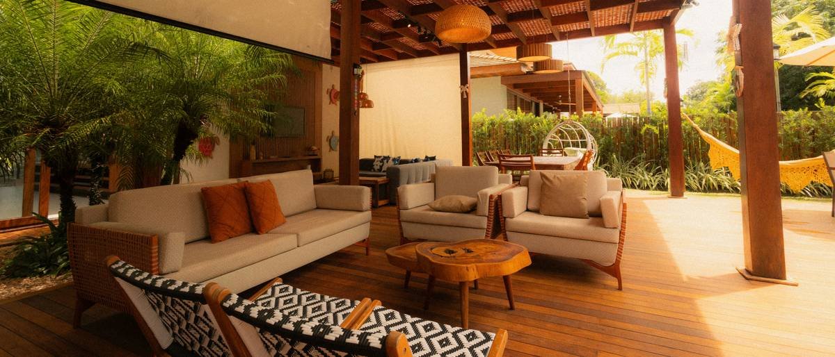 Comparison chart showing rattan, teak, and painted MDF durability in high-humidity coastal environments