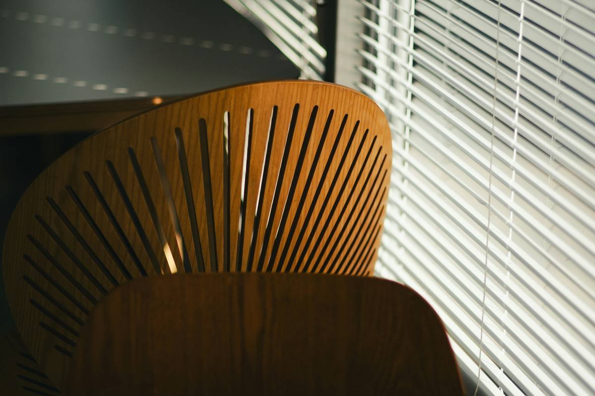 Close-up of coastal style office furniture showing rope drawer pulls and linen desk pad